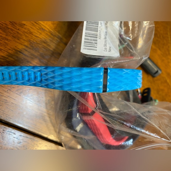 Silicone replacement bands for Fitbit.  And charger. - Picture 6 of 9